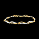 donna Bracciale a onde del Nilo due ori e diamanti